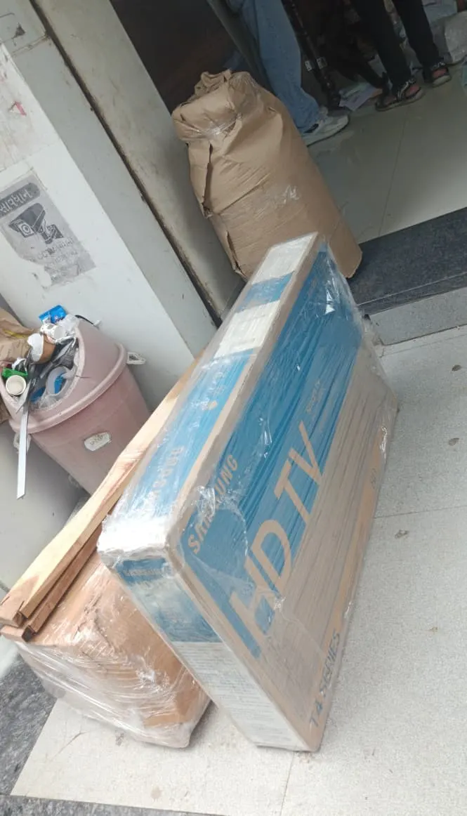 Samsung LED TV packed in a corrugated carton and stretch-wrapped for safe transport by Rapid Packers and Movers Surat