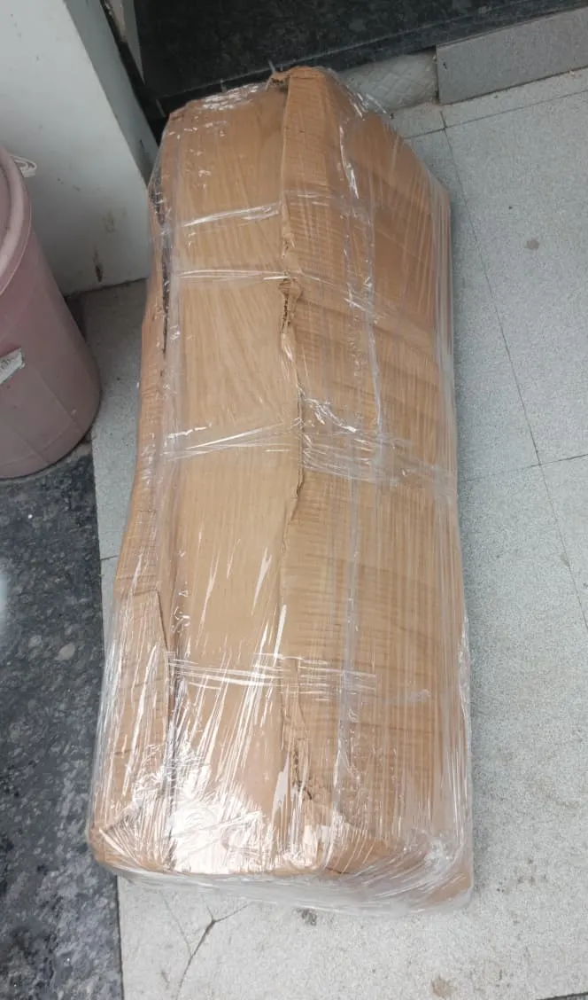 Mattress rolled, packed in corrugated paper and stretch-wrapped for a Surat home shifting job